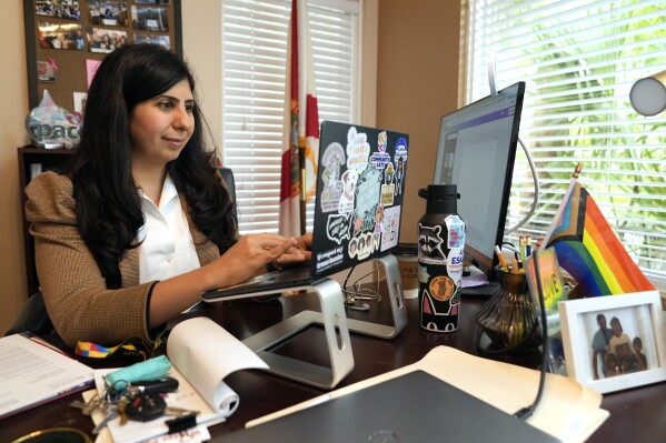 Florida state Rep. Anna Eskamani works in her office Wednesday, March 27, 2024, in Orlando, Fla. For the first time in 27 years, the U.S. government is announcing changes to how it categorizes people by race and ethnicity. "It feels good to be seen," said Eskamani, whose parents are from Iran. (AP Photo/John Raoux) embargoed until 8:45 am tomorrow