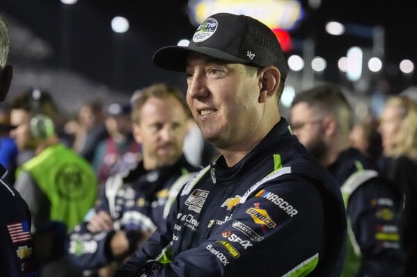 Kyle Busch waits by his car before the start of the first of two NASCAR Daytona 500 qualifying auto races at Daytona International Speedway, Thursday, Feb. 13, 2025, in Daytona Beach, Fla. (AP Photo/John Raoux)