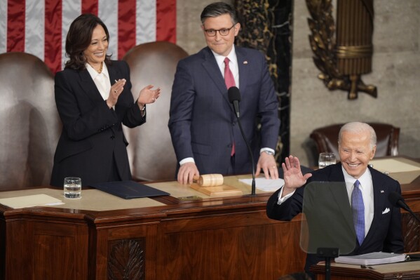 President Joe Biden arrives for the State of the Union address on Capitol Hill, Thursday, March 7, 2024, in Washington, as Vice President Kamala Harris and House Speaker Mike Johnson of La., watch. (AP Photo/Mark Schiefelbein)