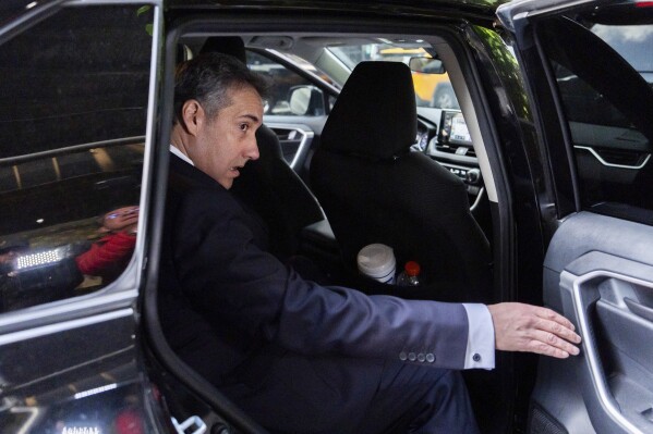 Michael Cohen leaves his apartment building on his way to Manhattan criminal court, Monday, May 13, 2024, in New York. (AP Photo/Julia Nikhinson)