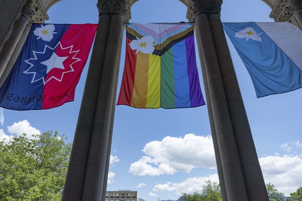The newly adopted city flags are displayed at the Salt Lake City and County building showing support for LGBTQ+ in defiance of their state's Republican controlled Legislature, Wednesday, May 7, 2025, in Salt Lake City. (AP Photo/Melissa Majchrzak)