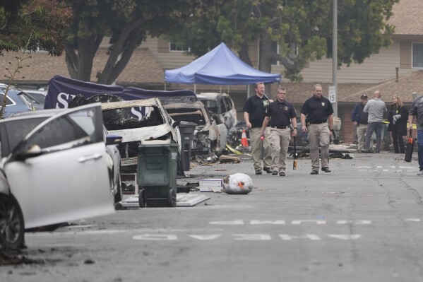Investigators work at the site of a plane crash Friday, May 23, 2025, in San Diego. (AP Photo/Gregory Bull)
