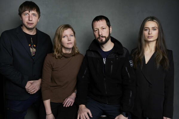 FILE - Photographer Evgeniy Maloletka, from left, 