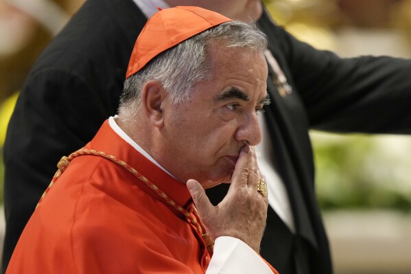 Cardinal Angelo Becciu attends the consistory inside St. Peter's Basilica, at the Vatican, Saturday, Aug. 27, 2022. Lawyers for the once-powerful cardinal have accused Vatican prosecutors of being “prisoners to their completely shattered theory" in closing arguments of a two-year trial. Becciu is on trial along with nine other people in a case that is focused on the Vatican’s 350 million-euro investment in a London property. (AP Photo/Andrew Medichini)