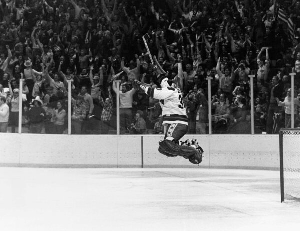FILE - In this Feb. 22, 1980, file photo, U.S. goalie James Craig leaps high in the air in the final second of a 4-3 win over the Soviet Union in a medal match at the 1980 Winter Olympics in Lake Placid, N.Y.  (AP Photo/File)