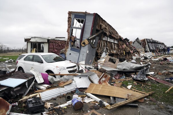 The remains of mobile homes are visible following a severe storm Friday, March 15, 2024, in Lakeview, Ohio. (AP Photo/Joshua A. Bickel)