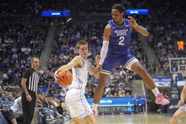 Georgia State forward Jamaine Mann (2) guards BYU forward Noah Waterman during the first half of an NCAA college basketball game Saturday, Dec. 16, 2023, in Provo, Utah. (AP Photo/Rick Bowmer)