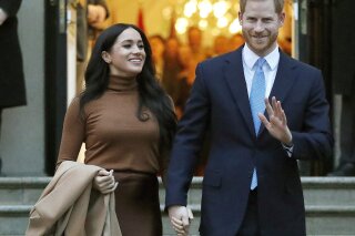 FILE - In this Jan. 7, 2020, file photo, Britain's Prince Harry and Meghan, Duchess of Sussex leave Canada House in London. Six months after detangling their work lives from the British royal family, the couple have signed a multiyear deal with Netflix. According to a statement Wednesday, they plan to produce nature series, documentaries and children’s programming through a new production company. The two recently relocated to Santa Barbara, California, with baby Archie.  (AP Photo/Frank Augstein, File)
