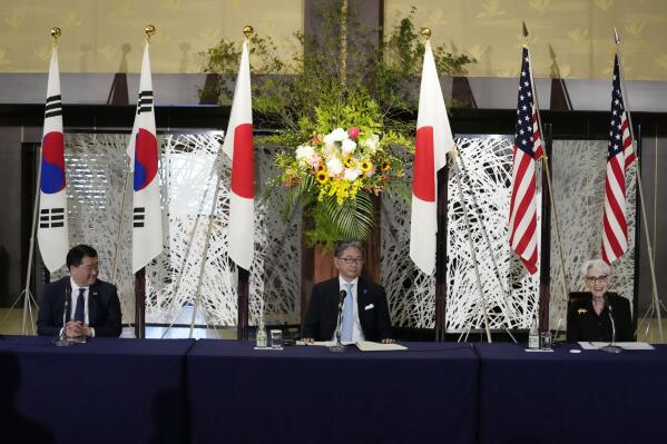 U.S. Deputy Secretary of State Wendy Sherman, right, South Korean First Vice Foreign Minister Choi Jong Kun, left, and Japanese Vice-Minister for Foreign Affairs Takeo Mori attend a press conference after their trilateral meeting at the Iikura Guesthouse Wednesday, July 21, 2021, in Tokyo. (AP Photo/Eugene Hoshiko)