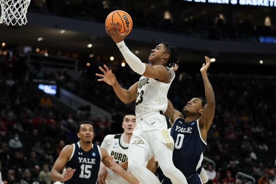 Purdue's Jaden Ivey shoots past Yale's Jalen Gabbidon during the second half of a first round NCAA college basketball tournament game Friday, March 18, 2022, in Milwaukee. (AP Photo/Morry Gash)