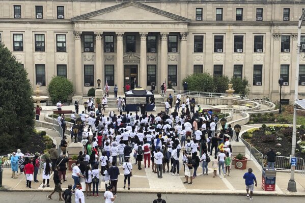 Student activists march in East Orange, N.J., Wednesday, Aug. 19, 2020, to protest the death of Maurice Gordon, a 28-year-old black man who was shot by New Jersey State Police during a traffic stop on May 23, 2020. (AP Photo/David Porter)