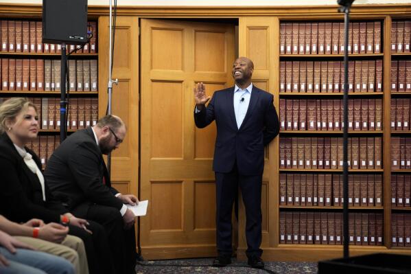 Sen. Tim Scott, R-S.C., waves to an audience member before speaking at a Faith in America Tour event, Wednesday, Feb. 22, 2023, at Drake University in Des Moines, Iowa. (AP Photo/Charlie Neibergall)