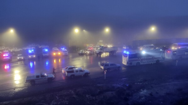 In this photo provided by Moj News Agency, rescue team vehicles are seen near the site of the accident of the helicopter carrying Iranian President Ebrahim Raisi in Farezgan, northwestern Iran, Sunday, May 19, 2024. A helicopter carrying the Iranian president, the country's president, the foreign minister and other officials appears to have crashed. in the mountainous regions of northwestern Iran on Sunday, sparking a large-scale rescue operation in a fog-shrouded forest while the public was urged to pray.  (Azin Haqiqi, Moj News Agency via Associated Press)