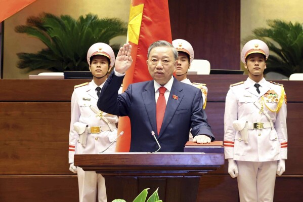 To Lam swears in the position after he was elected as the president at the National Assembly in Hanoi, Vietnam on Wednesday May 22, 2024. (Pham Trung Kien/VNA via AP)