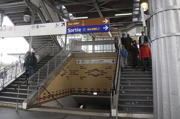 The access to a subway station is made possible only for pedestrians, Monday, April 24, 2023 in Paris. A rebuke from Europe's foremost human rights body and the looming deadline of what's billed as fully accessible Paris Olympics in 2024 are together upping pressure on President Emmanuel's government to better protect the rights of people with disabilities, as the French leader gathers campaigners together Wednesday at the Elysee Palace for France's first national conference on disabilities since the COVID-19 pandemic (AP Photo/Michel Euler)