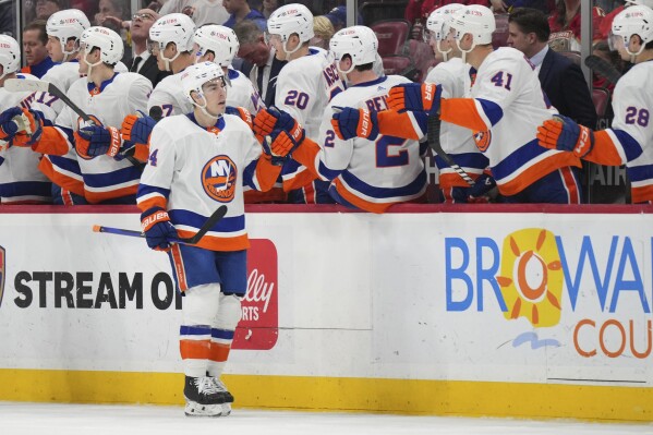 New York Islanders center Jean-Gabriel Pageau (44) is congratulated for a goal against the Florida Panthers during the during the second period of an NHL hockey game Thursday, March 28, 2024, in Sunrise, Fla. (AP Photo/Jim Rassol)