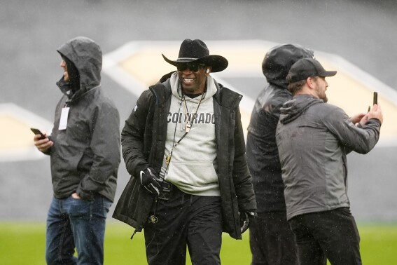 Colorado head coach Deion Sanders waits to direct players during the team's spring NCAA college football game Saturday, April 27, 2024, in Boulder, Colo. (AP Photo/David Zalubowski)