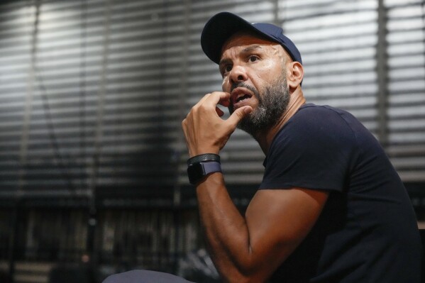 French-Algerian choreographer Mourad Merzouki guides his dancers as they rehearse for 