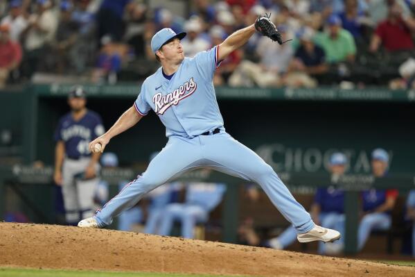 Texas Rangers relief pitcher Josh Sborz throws during the seventh inning of a baseball game against the Seattle Mariners in Arlington, Texas, Sunday, Aug. 14, 2022. The Rangers won 5-3. (AP Photo/LM Otero)