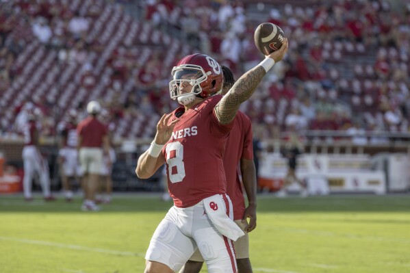 Oklahoma quarterback Dillon Gabriel warms up for the team's NCAA college football game against Iowa State, Saturday, Sept. 30, 2023, in Norman, Okla. (AP Photo/Alonzo Adams)