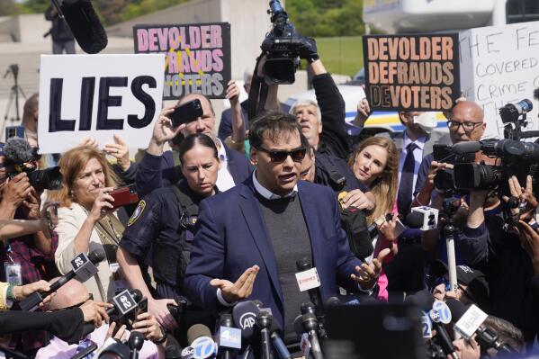 U.S. Rep. George Santos leaves the federal courthouse in Central Islip, N.Y., Wednesday, May 10, 2023. Santos pleaded not guilty to charges alleging a financial fraud at the heart of a political campaign built on dubious boasts about his personal wealth and business success. (AP Photo/Seth Wenig)