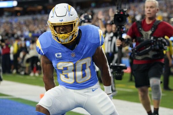 Los Angeles Chargers running back Austin Ekeler celebrates his touchdown during the first half of an NFL football game against the Chicago Bears, Sunday, Oct. 29, 2023, in Inglewood, Calif. (AP Photo/Ryan Sun)