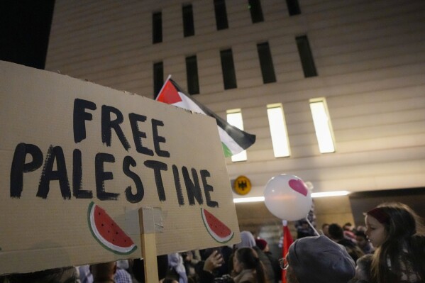 People shout slogans in front of the German embassy during a pro-Palestinian gathering in Belgrade, Serbia, Sunday, Nov. 12, 2023. (AP Photo/Darko Vojinovic, File)