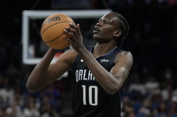 FILE - Orlando Magic's Bol Bol lines up a shot during the second half of an NBA basketball game against the Cleveland Cavaliers, April 6, 2023, in Orlando, Fla. The Phoenix Suns have traded guard Cameron Payne to the San Antonio Spurs and signed Bol to a one-year contract, a person familiar with the moves told The Associated Press. (AP Photo/John Raoux, File)