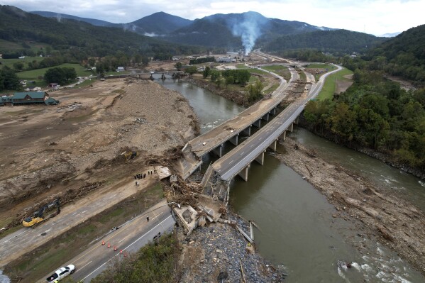 A bridge along Interstate 26 is destroyed in the aftermath of Hurricane Helene, Oct. 4, 2024, in Erwin, Tenn. (AP Photo/Jeff Roberson, File)