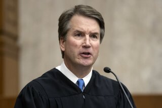 
              In this Aug. 7, 2018, photo, President Donald Trump's Supreme Court nominee, Judge Brett Kavanaugh, officiates at the swearing-in of Judge Britt Grant to take a seat on the U.S. Court of Appeals for the Eleventh Circuit at the U.S. District Courthouse in Washington. Kavanaugh has expressed concern about federal agencies running amok. But his view that they should adhere strictly to laws passed by Congress worries liberals.  (AP Photo/J. Scott Applewhite)
            