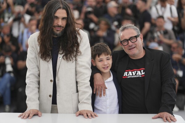 Director Oliver Laxe, from left, Bruno Nunez, and Sergi Lopez of the film "Sirat." (Photo by Lewis Joly/Invision/AP)