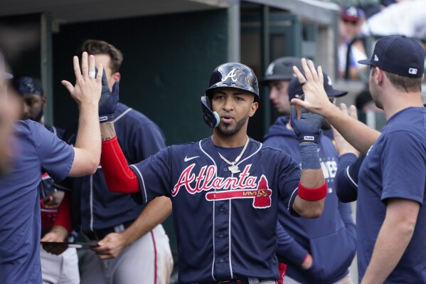 Eddie Rosario of the Atlanta Braves celebrates after hitting a double  News Photo - Getty Images