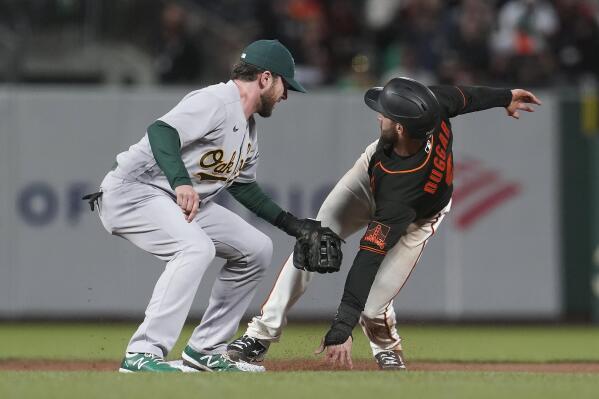 San Francisco Giants' Steven Duggar, right, steals second base safely next to Oakland Athletics second baseman Jed Lowrie during the fifth inning of a baseball game in San Francisco, Saturday, June 26, 2021. (AP Photo/Jeff Chiu)