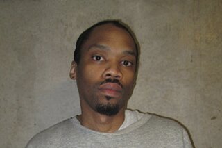 FILE - This undated file photo released by Oklahoma Department of Corrections shows Julius Jones. Oklahoma County's top prosecutor is asking the state's Pardon and Parole Board to reject a commutation request from Jones. Jones' case has drawn national attention and he's scheduled for a commutation hearing next week. Jones was convicted and sentenced to die for the 1999 shooting death of Edmond businessman Paul Howell. (Oklahoma Department of Corrections via AP File)