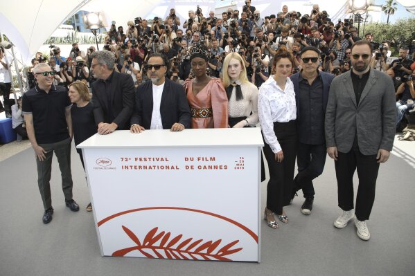 
              Jury members Robin Campillo, from left, Kelly Reichardt, Pawel Pawlikowski, jury president Alejandro Gonzalez Inarritu, jury members Maimouna N'Diaye, Elle Fanning, Alice Rohrwacher, Enki Bilal and Yorgos Lanthimos pose for photographers at the photo call for the jury at the 72nd international film festival, Cannes, southern France, Tuesday, May 14, 2019. (Photo by Vianney Le Caer/Invision/AP)
            