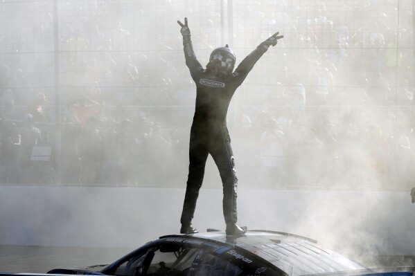 Austin Cindric celebrates after winning a NASCAR Cup Series auto race at World Wide Technology Raceway Sunday, June 2, 2024, in Madison, Ill. (AP Photo/Jeff Roberson)