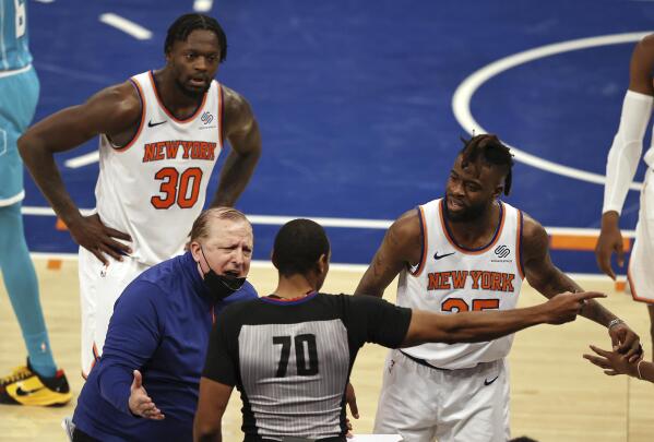 New York Knicks head coach Tom Thibodeau, Julius Randle (30)and Reggie Bullock the reacts after the ball is given to Charlotte Hornets with 11 seconds left in the fourth quarter of an NBA basketball game at Madison Square Garden, Saturday, May 15, 2021, in New York. (Elsa/Pool Photo via AP)