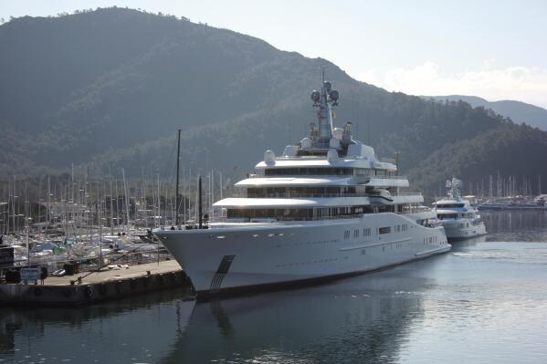 A view of Eclipse, a luxury yacht reported to belong to Russian businessman Roman Abramovich, docked at a port in the resort of Marmaris, Turkey, Tuesday, March 22, 2022. Turkish media reports say a second superyacht belonging to Chelsea soccer club owner and sanctioned Russian oligarch Roman Abramovich has docked in a resort in southwestern Turkey. The private DHA news agency said the Bermuda-registered Eclipse docked at a port in the resort of Marmaris on Tuesday. (IHA via AP)