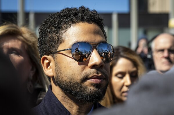 
              Actor Jussie Smollett leaves the Leighton Criminal Courthouse in Chicago on Tuesday March 26, 2019, after prosecutors dropped all charges against him. Smollett was indicted on 16 felony counts related to making a false report that he was attacked by two men who shouted racial and homophobic slurs. (Ashlee Rezin/Sun-Times/Chicago Sun-Times via AP)
            