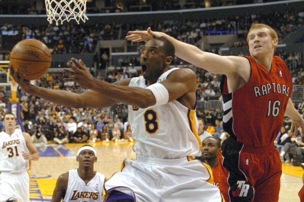 FILE - Toronto Raptors' Matt Bonner can't stop Los Angeles Lakers' Kobe Bryant from getting to the basket in the first half of NBA basketball action on Jan. 22, 2006, in Los Angeles. Bryant scored 81 points in the game as the Lakers beat the Raptors, 122-104. (AP Photo/Matt A. Brown, File)