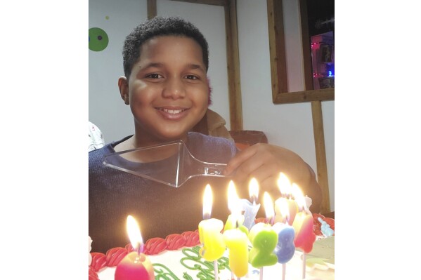 Ahmir Jolliff, who was killed in a school shooting on Thursday, Jan. 4, 2024, in Perry, Iowa, poses at one of his birthday parties in this undated photo provided by his mother. He was 11 years old and a sixth grader when he died. Authorities say a 17-year-old opened fire in the cafeteria of Perry High School before classes began for the day, killing Ahmir and wounding seven other people. The teenage suspect died of a self-inflicted gunshot wound. (Erica Jolliff via AP)
