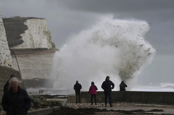 Waves crash over the harbour wall in Newhaven, southern England, Thursday, Nov. 2, 2023. Winds up to 180 kilometers per hour (108 mph) slammed France's Atlantic coast overnight as Storm Ciaran lashed countries around western Europe, uprooting trees, blowing out windows and leaving 1.2 million French households without electricity Thursday. Strong winds and rain also battered southern England and the Channel Islands, where gusts of more than 160 kph (100 mph) were reported. (AP Photo/Kin Cheung)