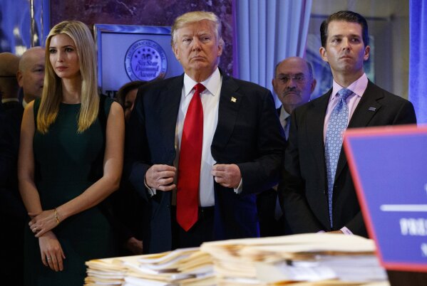 
              In this Jan. 11, 2017, photo, President-elect Donald Trump, center, stands next to Allen Weisselberg, second from left, Donald Trump Jr., right and Ivanka Trump, left, at a news conf...