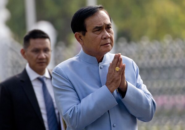 
              Thai Prime Minister Prayuth Chan-ocha arrives at the government house in Bangkok, Thailand, Tuesday, March 26, 2019. The junta-appointed Election Commission announced the results of 350 constituency races but said full vote counts, which are needed to allocate 150 other seats in the House of Representatives, won't be available until Friday after apparent counting problems. (AP Photo/Sakchai Lalit)
            