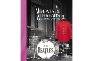 This cover image released by Julien's Auctions shows "Beats & Threads" by Ringo Starr, an illustrated journey through the former Beatles drummer's career, featuring images of everything from his drum kits to his trend-setting wardrobe. The 312-page book is being sold through the publishing division of Julien's Auctions. (Julien's Auctions via AP)
