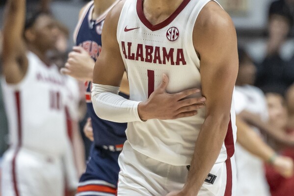 Alabama guard Mark Sears (1) celebrates a 3-point shot during the second half of the team's NCAA college basketball game against Auburn, Wednesday, Jan. 24, 2024, in Tuscaloosa, Ala. (AP Photo/Vasha Hunt)