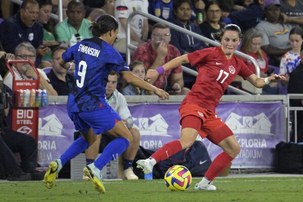 FILE - Canada midfielder Jessie Fleming (17) and U.S. forward Mallory Swanson (9) compete for the ball during the first half of a SheBelieves Cup women's soccer match, Thursday, Feb. 16, 2023, in Orlando, Fla. The Portland Thorns have acquired Canadian midfielder Jessie Fleming via a transfer from Chelsea. Fleming, 25, will join the team pending receipt of her visa and international transfer, the team announced Wednesday, Jan. 31, 2024. (AP Photo/Phelan M. Ebenhack, File)