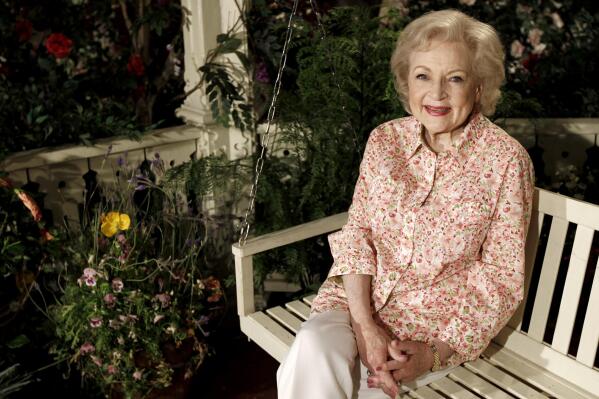 FILE - Actress Betty White poses for a portrait on the set of the television show "Hot in Cleveland" in Studio City section of Los Angeles on Wednesday, June 9, 2010.  Betty White, whose saucy, up-for-anything charm made her a television mainstay for more than 60 years, has died. She was 99.  (AP Photo/Matt Sayles, File)