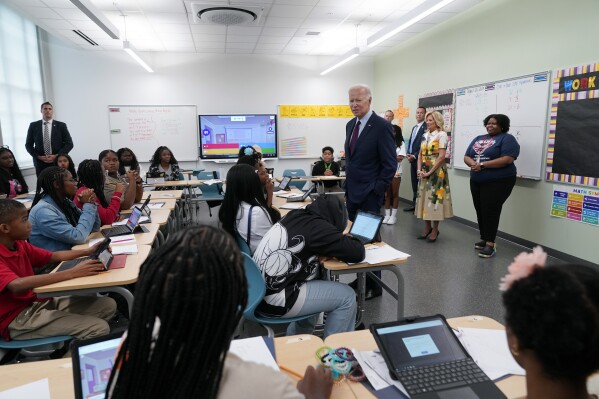 President Joe Biden speaks with students at Eliot-Hine Middle School on Monday, Aug. 28, 2023, in Washington. Biden visited the school, located east of the U.S. Capitol, to mark the District of Columbia's first day of school for the 2023-24 year. (AP Photo/Manuel Balce Ceneta)