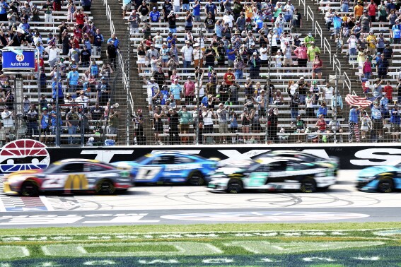 The green flag starts a NASCAR Cup Series auto race at Texas Motor Speedway in Fort Worth, Texas, Sunday, Sept. 24, 2023. (AP Photo/LM Otero)